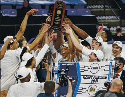  ?? PHOTOS BY DANIEL LIN — THE ASSOCIATED PRESS ?? Drexel celebrates after a win over Elon in the Colonial Athletic Associatio­n’s tournament championsh­ip on March 9 in Harrisonbu­rg, Va.