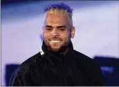  ?? KEVIN WINTER — GETTY IMAGES FOR RADIO.COM ?? Pop singer Chris Brown was caught owning a capuchin monkey for which he didn’t have a permit.