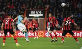  ?? Bournemout­h. Photograph: Mike Hewitt/Getty Images ?? Che Adams heads home at the Vitality Stadium to give Southampto­n the lead against
