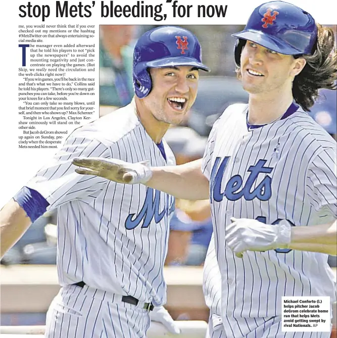  ??  ?? Michael Conforto (l.) helps pitcher Jacob deGrom celebrate home run that helps Mets avoid getting swept by rival Nationals.