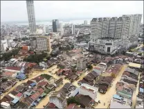  ?? PICTURE: AP ?? An aerial view shows a flooded George Town city in Penang, Malaysia, yesterday. A northern Malaysian state has been paralysed by a severe storm that led to two deaths and some 2 000 people evacuated in the worst flooding in years, officials say.