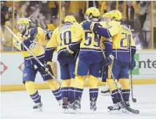  ?? AP PHOTO ?? ON A ROLL: The Predators celebrate a goal by Roman Josi during their win yesterday in Nashville, Tenn.