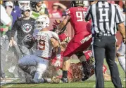  ?? RICARDO B. BRAZZIELL / AMERICAN-STATESMAN ?? Texas defensive back Brandon Jones is forced out of bounds during Saturday’s loss to Maryland at FedEx Field in Landover, Md. Jones has an injured ankle.