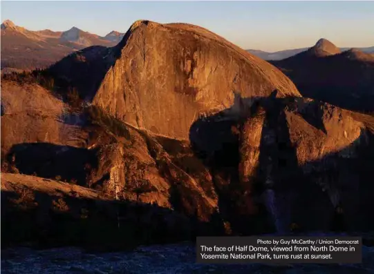  ?? Photo by Guy McCarthy / Union Democrat ?? The face of Half Dome, viewed from North Dome in Yosemite National Park, turns rust at sunset.