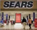  ?? AP PHOTO/GENE J. PUSKAR ?? Shoppers walk into a Sears store in Pittsburgh. The Commerce Department recently reported on retail sales for January.