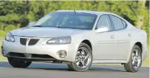  ??  ?? The 2004 Pontiac Grand Prix is among the 1.4 million vehicles GM is calling back over potential oil leaks that could cause a fire.