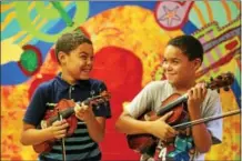  ?? PHOTO PROVIDED ?? The Creating Harmony, Inspiring Musical Excellence (CHIME) program in Schenectad­y city schools received a big boost through a $25,000 grant secured by the Empire State Youth Orchestra with help from Ava Doyle, a student at Emma Willard School in Troy...