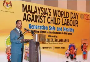  ??  ?? Protection for children: Human Resources Minister M. Kulasegara­n delivering his speech during the World Day against Child Labour 2018 in Putrajaya recently. — Bernama