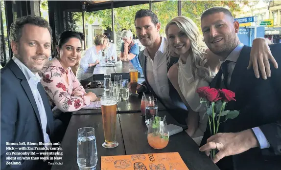  ?? Tess Nichol ?? Simon, left, Alene, Sharon and Nick — with Zac Franich, centre, on Ponsonby Rd — were staying silent on why they were in New Zealand.