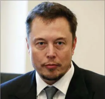  ?? EVAN VUCCI — THE ASSOCIATED PRESS FILE ?? In this file photo, Tesla CEO Elon Musk listens as President-elect Donald Trump speaks during a meeting with technology industry leaders at Trump Tower in New York.