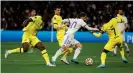  ?? ?? Luka Modric tries to pick a way through Chelsea. His perfect pass set up one of Real Madrid’s goals. Photograph: Juan Medina/ Reuters