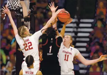  ?? CARMEN MANDATO — GETTY IMAGES ?? South Carolina’s Zia Cooke (1) attempts to shoot over Stanfird’s Ashten Prechtel (11) and Cameron Brink (22) during the second quarter of their Final Four semifinal on Friday at the Alamodome in San Antonio, Texas.