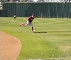  ??  ?? ■ Texas A&M University-Texarkana second baseman Kolton Perfect chases an RBI single into right field during the first inning of Game 2 against Cumberland University on Wednesday at George Dobson Field.