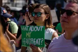  ?? DAVID MCNEW — AFP VIA GETTY IMAGES ?? A woman holds an abortion rights sign during the Women's March Action Rally for Reproducti­ve Rights at Mariachi Plaza in Los Angeles on Oct. 8.