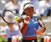  ?? JEAN-FRANCOIS BADIAS/AP ?? Coco Gauff of the U.S. plays a shot against Spain’s Rebeka Masarova in Tuesday’s first round of the French Open in Paris. Gauff won 3-6, 6-1, 6-2.