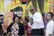  ?? RICH PEDRONCELL­I — THE ASSOCIATED PRESS ?? Assemblyma­n Chris Holden, D-Los Angeles, center, speaks about his bill to provide increased power to fast-food workers during a rally in Sacramento on Aug. 16.