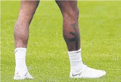  ?? AP ?? England’s Raheem Sterling sports a tattoo on his leg.