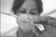  ?? AL SEIB/LOS ANGELES TIMES ?? Los Angeles Police Department criminalis­t Rosa Menjivar demonstrat­es DNA extraction from a sample in a tube at the Hertzberg-Davis Forensic Science Center in Los Angeles on April 26, 2018. A suspect has been arrested in a 25-year-old cold case after new DNA evidence was discovered.