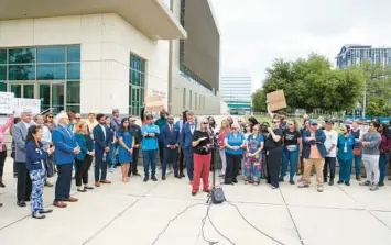  ?? RICH POPE/ORLANDO SENTINEL ?? Martha Are, executive director of the Homeless Services Network of Central Florida, speaks outside the George C. Young Federal Building and Courthouse in downtown Orlando on Monday as nonprofit and community leaders joined together to speak out about the rights of homeless people.