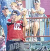  ?? James Franco / Special to the Times Union ?? A Tri-city Valleycat fan nearly catches a foul ball during a 2019 game. The Valleycats will still be conducting health screenings.