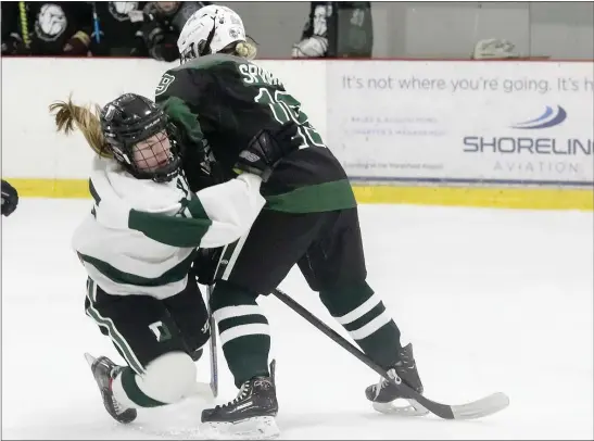  ?? PHOTO BY PAUL CONNORS — MEDIA NEWS GROUP/BOSTON HERALD ?? Duxbury’s Megan Carney, left, collides with Canton’s Devan Spinale while attempting to penetrate the Canton zone during a 1-1 girls hockey tie Saturday.