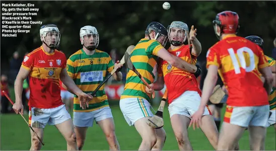  ??  ?? Mark Kelleher, Eire Og, gets the ball away under pressure from Blackrock’s Mark O’Keeffe in their County IHC quarter-final Photo by George Hatchell