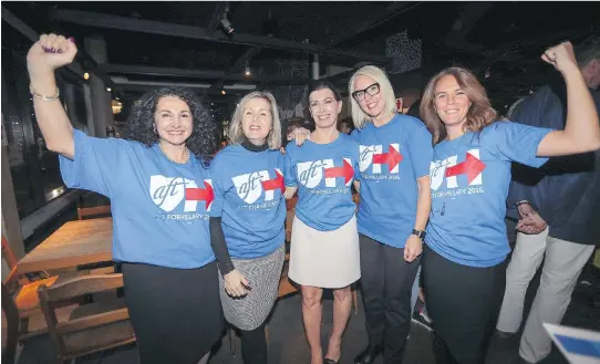  ?? JOHN MAHONEY ?? Hillary Clinton supporters, from left, Rose Fierimonte, Marie-Josée Lanciault, Sylvia Chouinard, Marie-Sophie Dion and Geneviève Nadeau watch early results from the U.S. presidenti­al election at an event organized by Women in Mind, a neighbourh­ood social network created by and for women, at a restaurant in the Nun’s Island area of Montreal Tuesday.