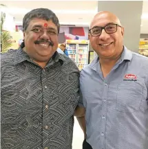  ?? Photo: Charles Chambers ?? From left: Shop N Save Managing Director Rattan Deo, left with Punja and Sons Limited Director Rajesh Punja following the opening of the supermarke­t on February 27, 2020.