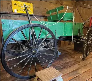  ?? (Photo by Neil Abeles) ?? No prettier horse wagon has existed than this green and gold one in the Atlanta Museum. Here’s a trick question — with no answer to be given here. What’s that white rope tied to and why? How did it work?