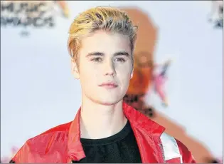  ?? AP PHOTO ?? In this November 2015 file photo, Justin Bieber arrives at the Cannes festival palace in Cannes, southeaste­rn France. He didn’t specifical­ly say sorry, but Bieber has finally given his fans an explanatio­n of why he decided to suddenly back out of his...