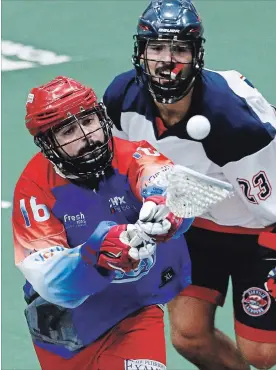  ?? CLIFFORD SKARSTEDT EXAMINER ?? Peterborou­gh Century 21 Lakers' Adam Jones picks up a loose ball against Oakville Rock's Challen Rogers during second period of Game 5 Major Series Lacrosse championsh­ip series at the Memorial Centre on Thursday night.