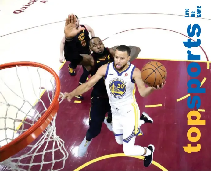  ?? (AP) ?? WARRIORS guard Stephen Curry shoots next to Cleveland Cavaliers’ LeBron James during the second half of Game 3 of basketball’s NBA Finals, Wednesday, June 6, 2018, in Cleveland. The Warriors defeated the Cavaliers 110-102 to take a 3-0 lead in the...
