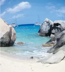  ?? MICHELE JARVIE ?? One-of-a-kind granite boulders lay on the beach on Virgin Gorda, creating hidden pools and caves.