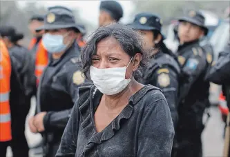  ?? LUIS SOTO
THE ASSOCIATED PRESS ?? A resident cries after she was evacuated from her home in Escuintla, Guatemala, Monday.