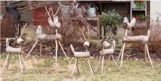  ??  ?? Above: A herd of handmade log reindeer have special meaning for the Thomases. “That’s my family,” Robyn says. “Keith and I and the three kids.”