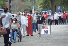  ?? MICHAEL HOLAHAN/USA TODAY NETWORK ?? Monday was the first day for advance voting in Georgia, and hundreds showed up to cast their ballot early in Augusta.