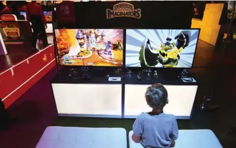  ?? RICHARD LAUTENS/TORONTO STAR ?? Mikan Bronsteter, 6, plays the new Skylanders game at Nintendo Switch’s media preview this weekend at the Metro Toronto Convention Centre.