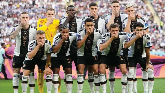  ?? ?? Germany's players covered their mouths for the team photo before their opening World Cup match on Wednesday to protest against FIFA following the governing body's clampdown on the “One Love” armband. Photo: Ebrahim Noroozi/AP