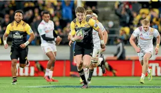  ?? OTO: PHOTOSPORT ?? Final here we come: Hurricanes playmaker Beauden Barrett even has time to look at the big screen before dotting down for his try in the Super Rugby semifinal win over the Chiefs on Saturday.