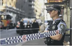  ?? PICTURE: ALEX BRITTON/DEAN LEWINS/AAP IMAGE VIA AP ?? 0 Clockwise from top: Luke, left, and Paul O’shaughness­y; an injured woman is stretchere­d into an ambulance; a Sydney officer behind police tape.