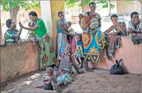  ?? [JEROME DELAY/ASSOCIATED PRESS FILE PHOTO] ?? Residents of the Malawi village of Tomali wait to have their young children become test subjects for the world's first vaccine against malaria.