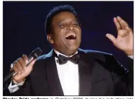  ?? More photos at arkansason­line.com/1213pride/ (AP File/Charlie Neibergall) ?? Charley Pride performs in October 2000 during his induction into the Country Music Hall of Fame at the Country Music Associatio­n Awards show at the Grand Ole Opry House in Nashville, Tenn. Pride died Saturday in Dallas of complicati­ons from Covid-19, sources say.