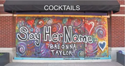  ?? SAM UPSHAW JR./USA TODAY NETWORK ?? Artists have been transformi­ng boards into art bearing Breonna Taylor’s name and covering the windows at downtown businesses in Louisville, Ky. The murals will be auctioned off.