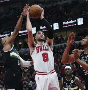  ?? (AP/Nam Y. Huh) ?? Chicago guard Zach LaVine (middle) signed the richest contract in Bulls history Friday, agreeing to a five-year deal worth $215 million. LaVine averaged 24.4 points, 4.6 rebounds and 4.5 assists last season.