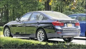  ?? Will Waldron / Times Union ?? The BMW sedan belonging to Allison Mack, a TV actress who had devoted herself to NXIVM and its leader, is parked in the Knox Woods developmen­t in Halfmoon, location of multiple homes associated with NXIVM members.