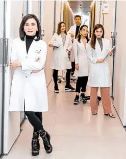  ??  ?? Dr. Vicki Belo with staff and husband Dr. Hayden Kho (far end) in file photo: “Remember to be kind always”