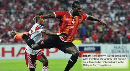  ??  ?? Ready: Sime Darby’s Patrick Ronaldinho Wleh (right) wants to show that his side are a force to be reckoned with in the Malaysia Cup competitio­n.