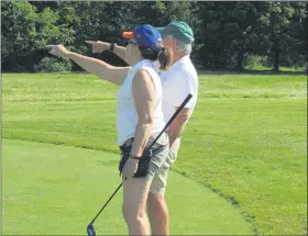  ?? COURTESY OF MONTGOMERY COUNTY ASSOCIATIO­N FOR THE BLIND ?? uzanne Woodall, who is visually impaired, gets help from her volunteer coach.