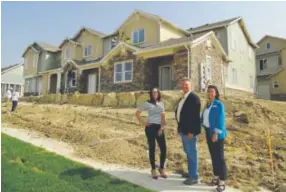  ??  ?? Builder Ward Ritter with sales reps Hillary, left, and Nicole at Enclave at Vista Ridge, a luxury all-rental community in Erie opening today with four units you can preview. At right, an artist’s rendering of an interior at Enclave at Vista Ridge.