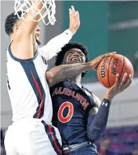  ?? DOUGLAS P. DEFELICE GETTY IMAGES ?? Friday’s game against Tyrell Jones and the Auburn Tigers went ahead even after Gonzaga’s two positive COVID tests.